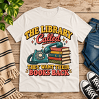 The Library Called book lovers graphic t-shirt cozy flat lay in vintage white.