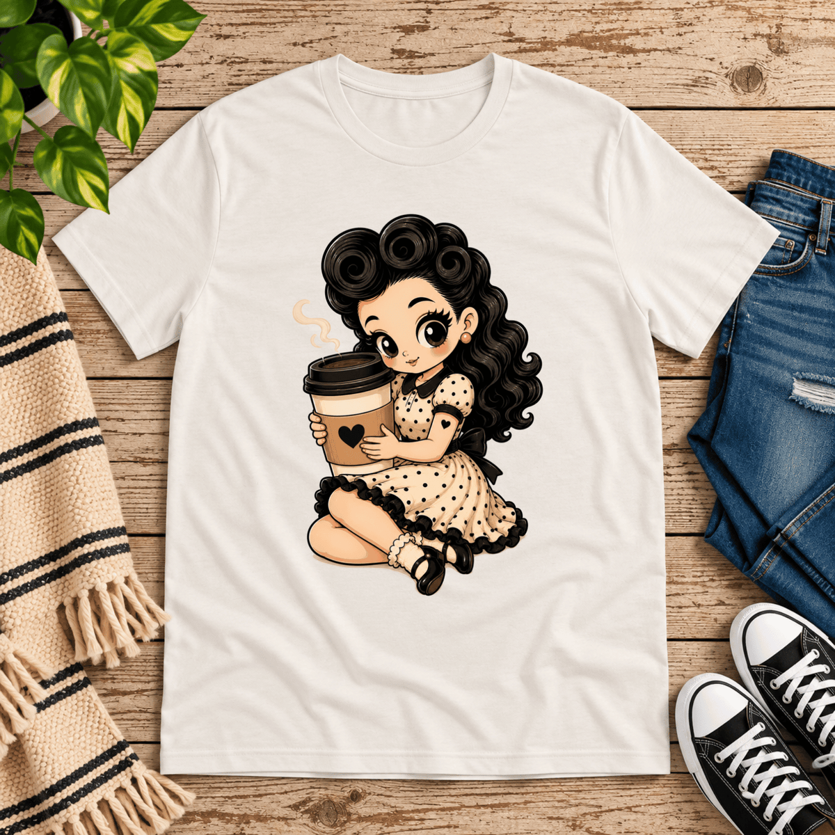 Coffee Clara pinup graphic t-shirt cozy flat lay in vintage white.