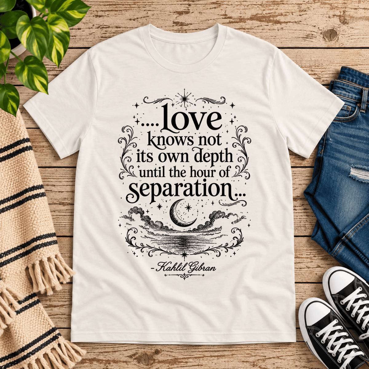 Love Knows Not book quote graphic t-shirt cozy flat lay in vintage white.