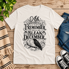 Bleak December book quote graphic t-shirt cozy flat lay in vintage white.