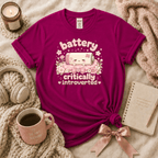 Cute Battery introvert graphic t-shirt cozy flat lay in antique heliconia.