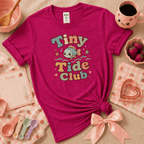 Tiny Tide Club cute animal graphic t-shirt displayed in a cozy flat lay in antique heliconia.