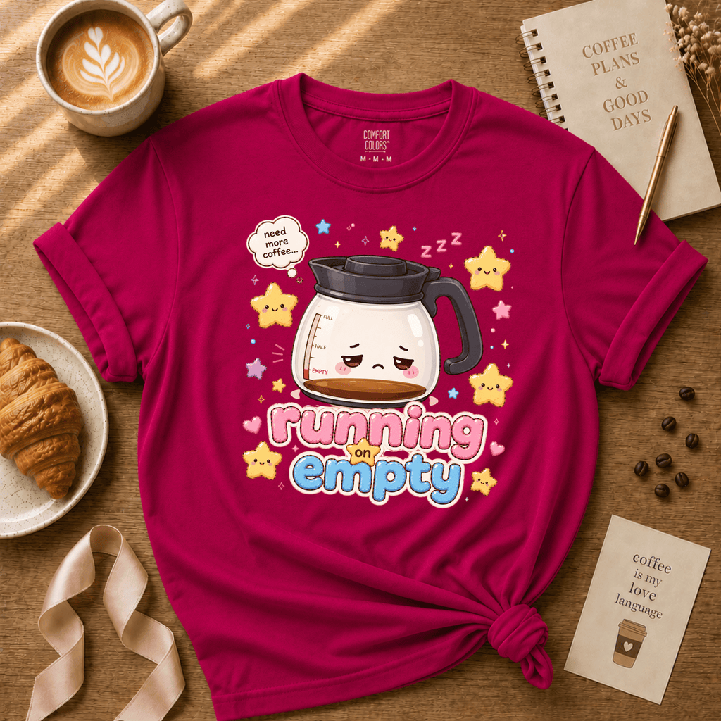Running on Empty coffee lover graphic t-shirt cozy flat lay in antique heliconia.
