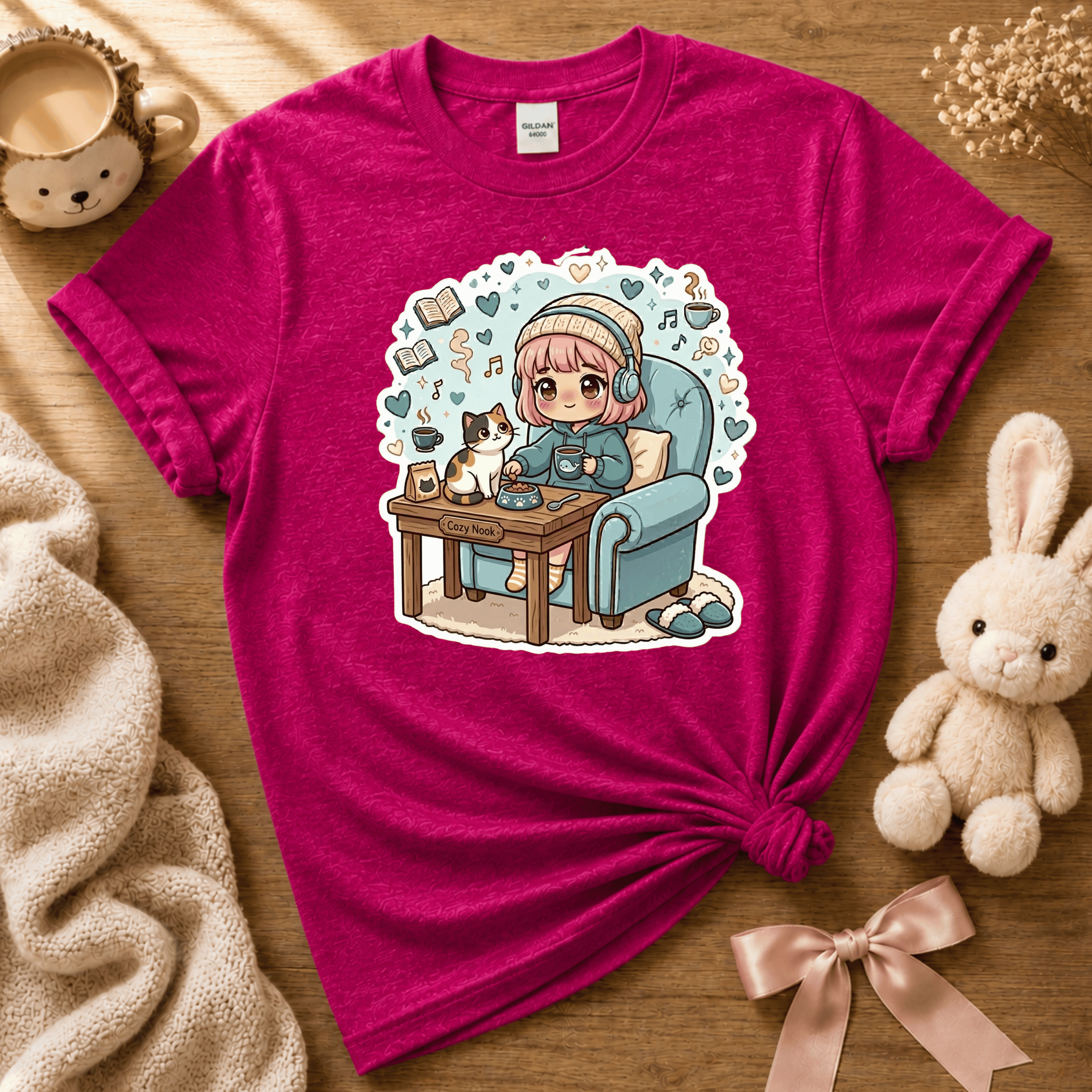 Cat Cozy Nook cute animal graphic t-shirt cozy flat lay in antique heliconia.
