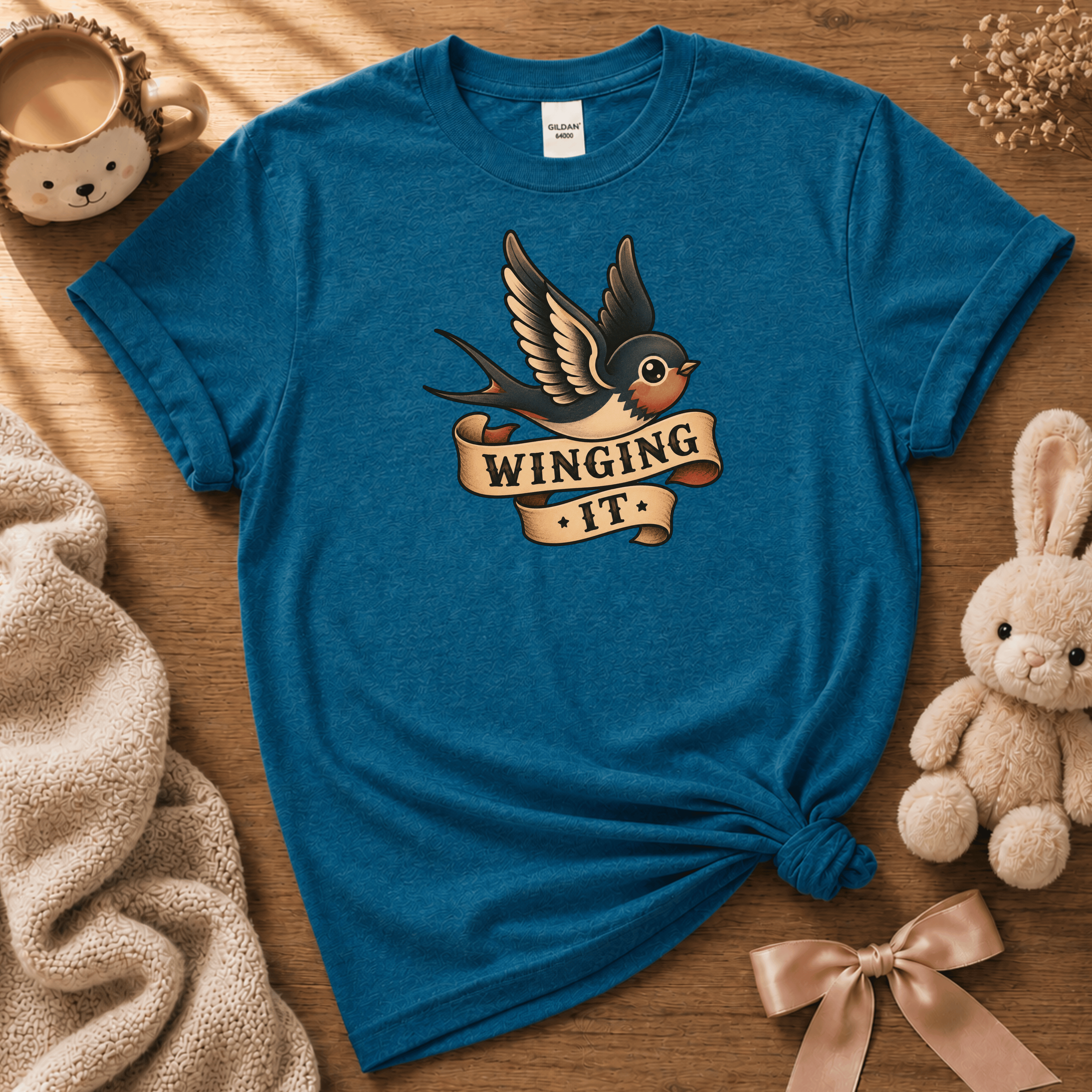 Winging it cute animal graphic t-shirt cozy flat lay in antique sapphire blue.