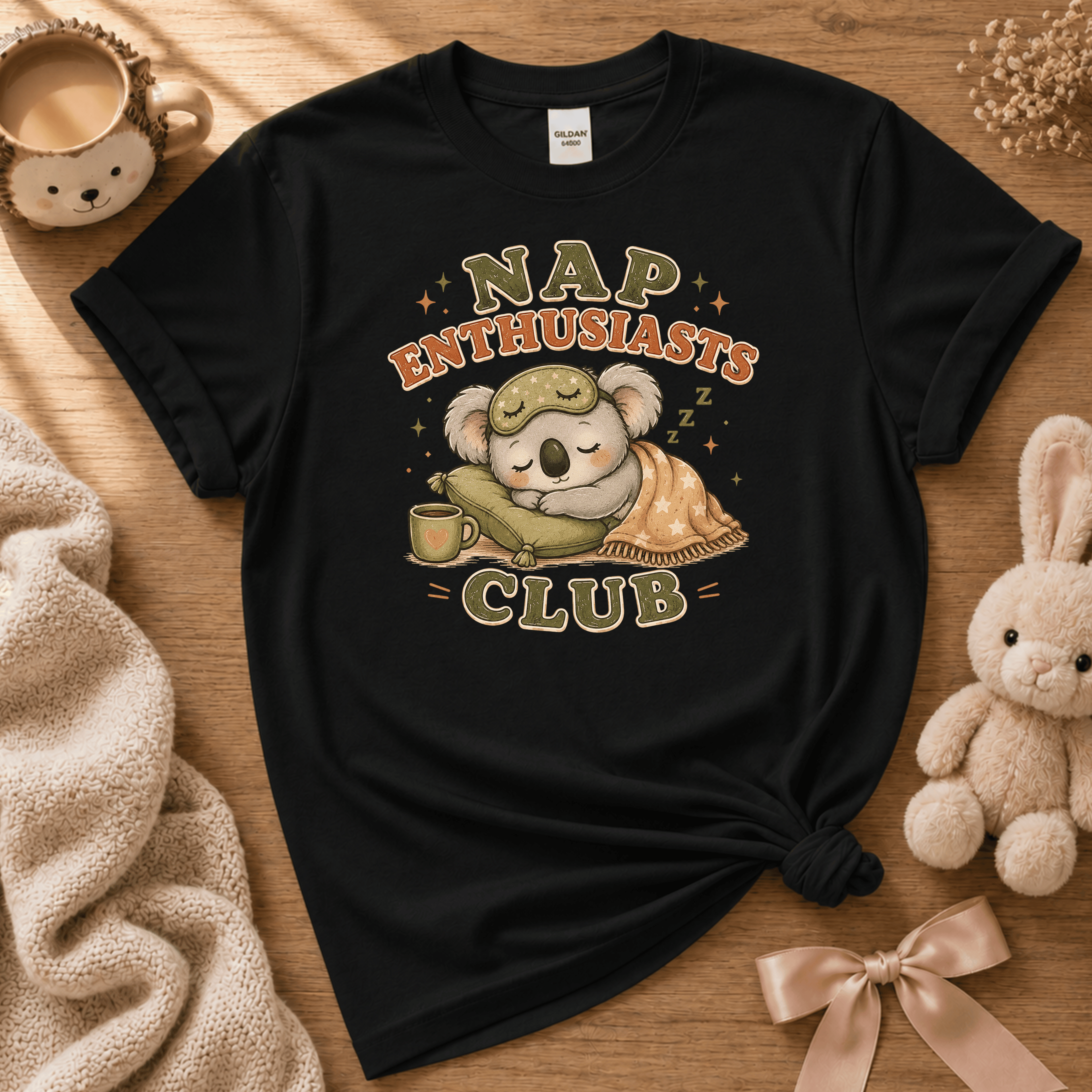 Nap Enthusiasts Club cute animal graphic t-shirt cozy flat lay in black.