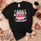 Recharging Cherries Kawaii cute fruit graphic t-shirt cozy flat lay in black.