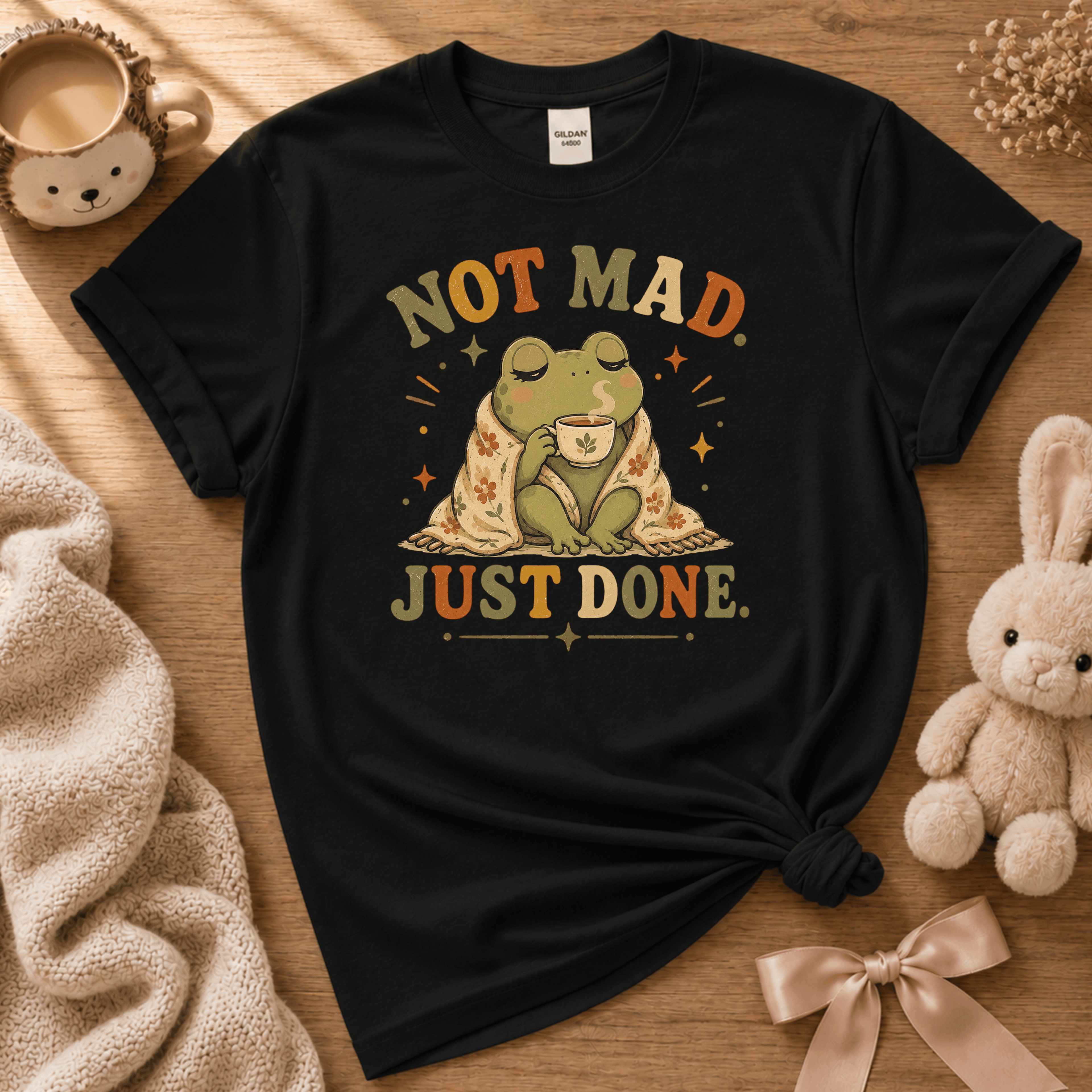Just Done cute animal graphic t-shirt displayed in a cozy flat lay in black.