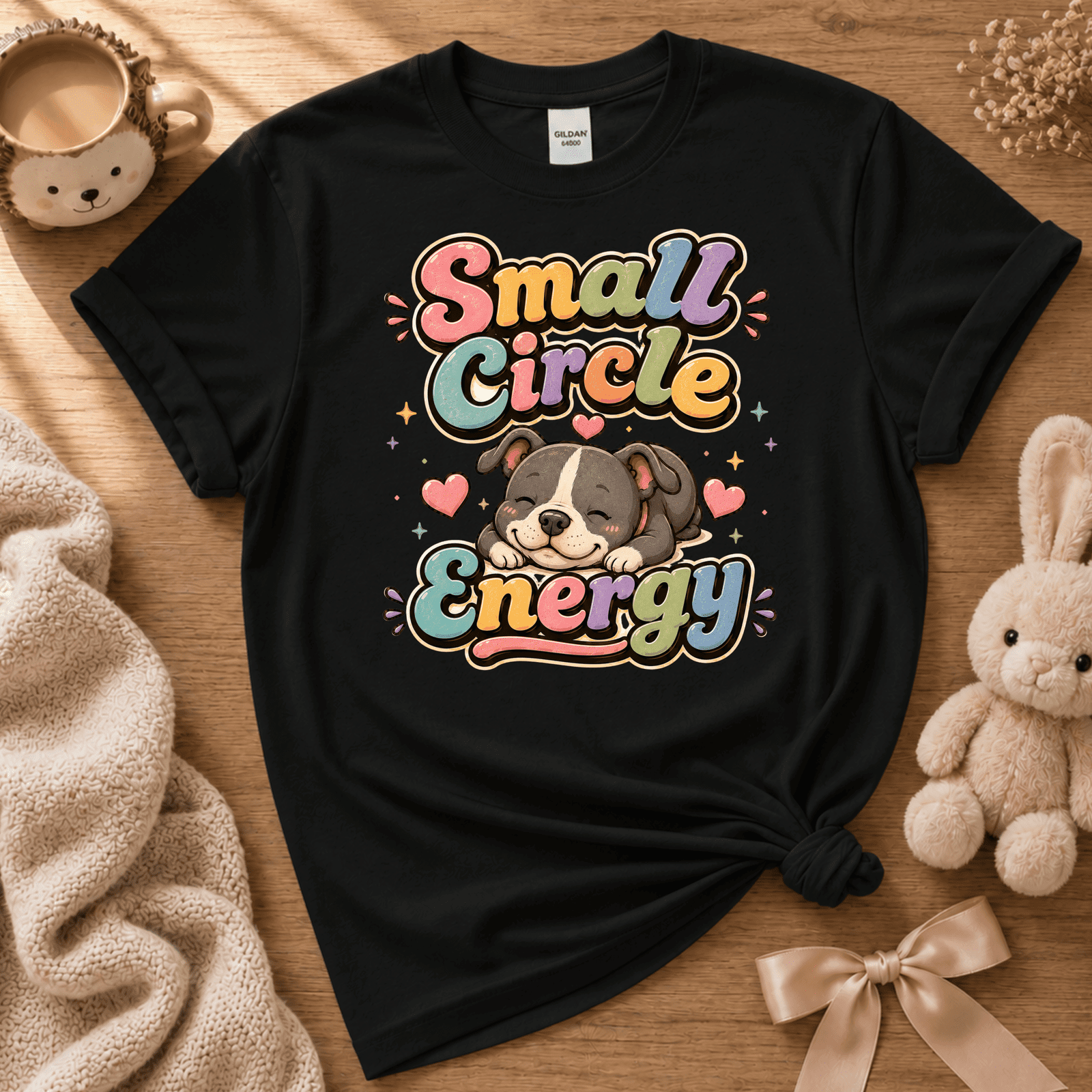 Small Circle Energy cute animal graphic t-shirt displayed in a cozy flat lay in black.