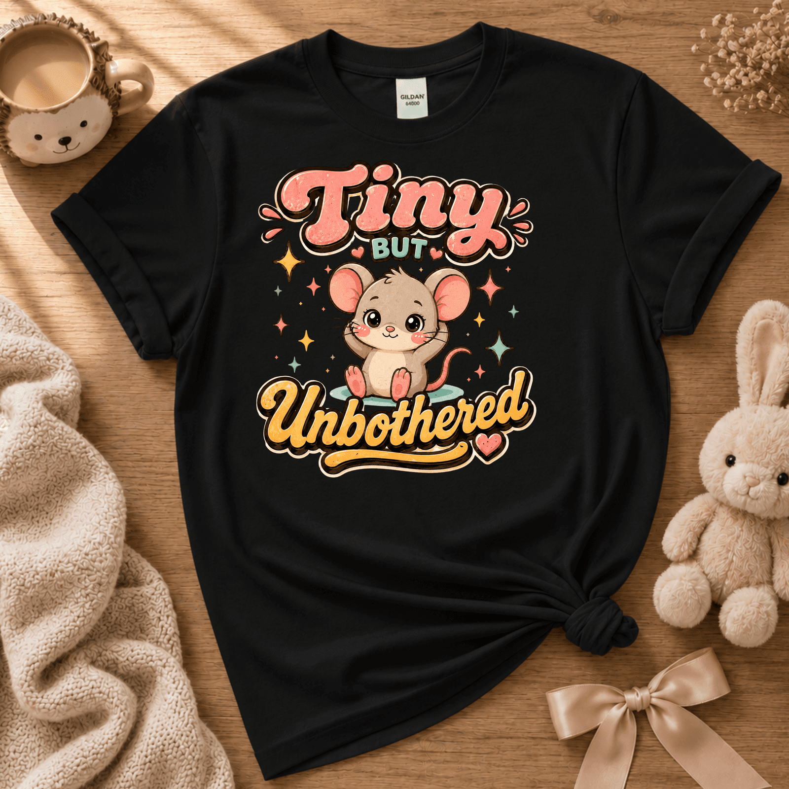 Tiny But Unbothered cute animal graphic t-shirt cozy flat lay in black.