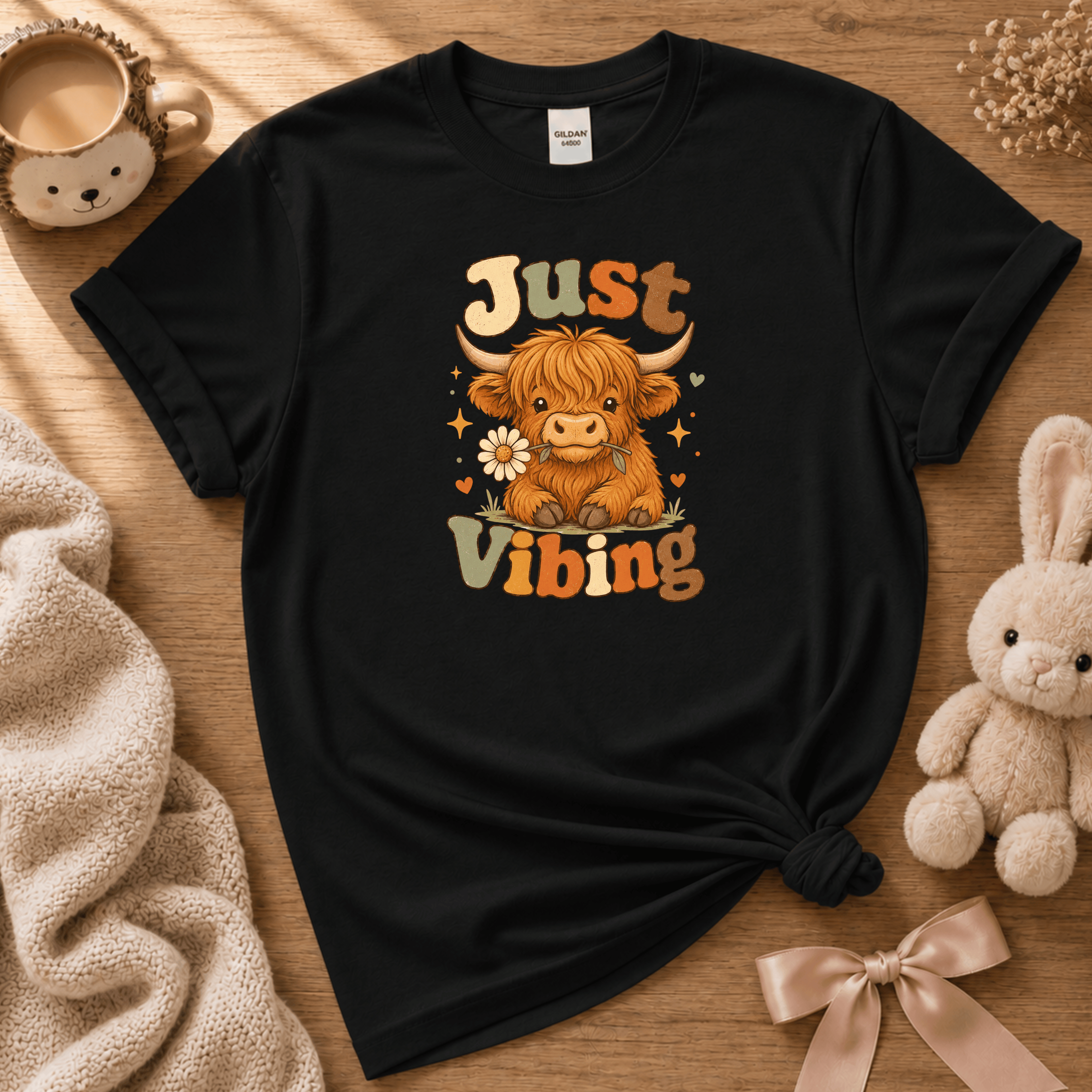 Cow Just Vibing cute animal graphic t-shirt cozy flat lay in black.