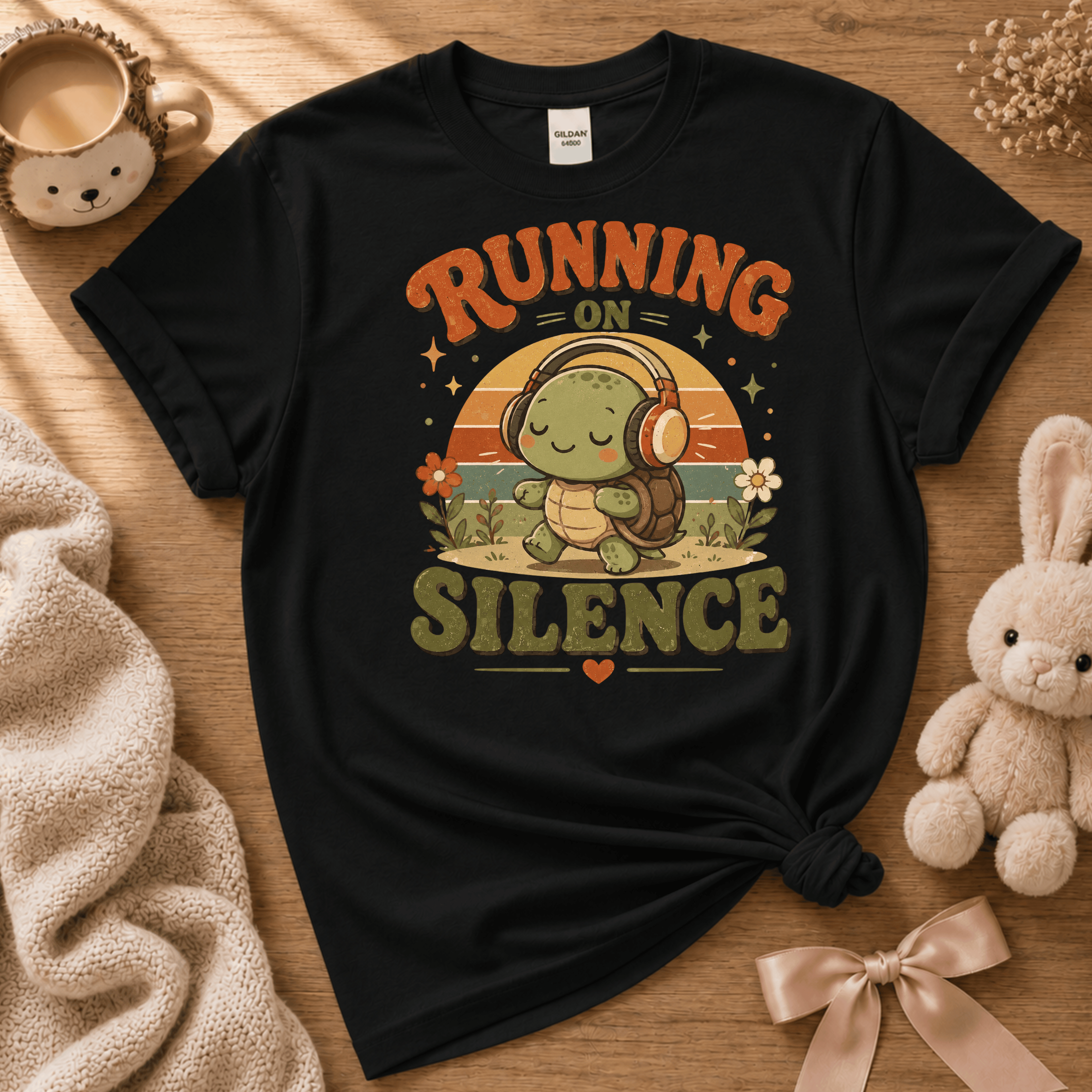 Running On Silence cute animal graphic t-shirt displayed in a cozy flat lay in black.