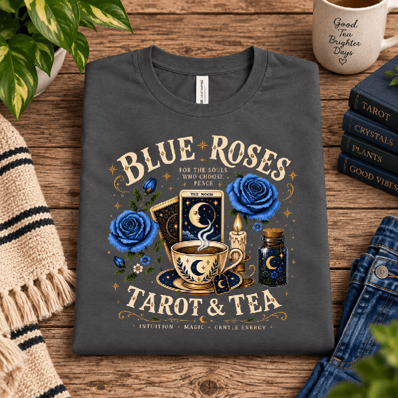 Blue Roses Premium T-Shirt in asphalt gray, folded close-up styled with tarot-themed mug and books