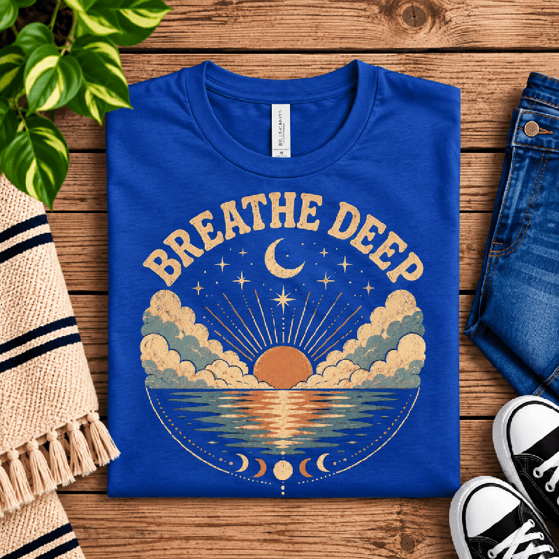 Breathe Deep Premium T-Shirt in true royal blue, folded close-up with neck tag showing
