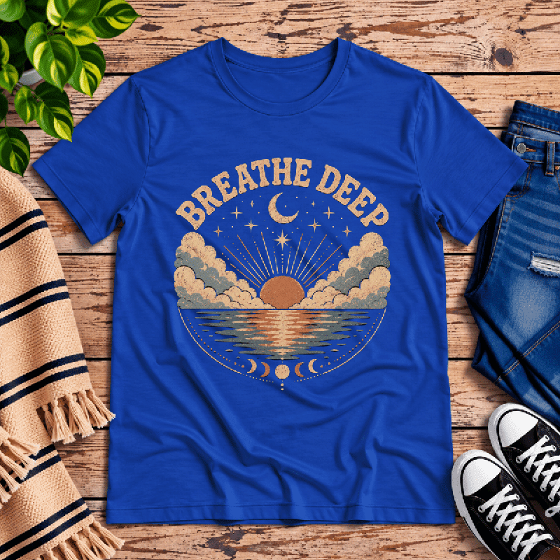 Breathe Deep Premium T-Shirt in true royal blue, flat lay with celestial sunset and moon-phase graphic