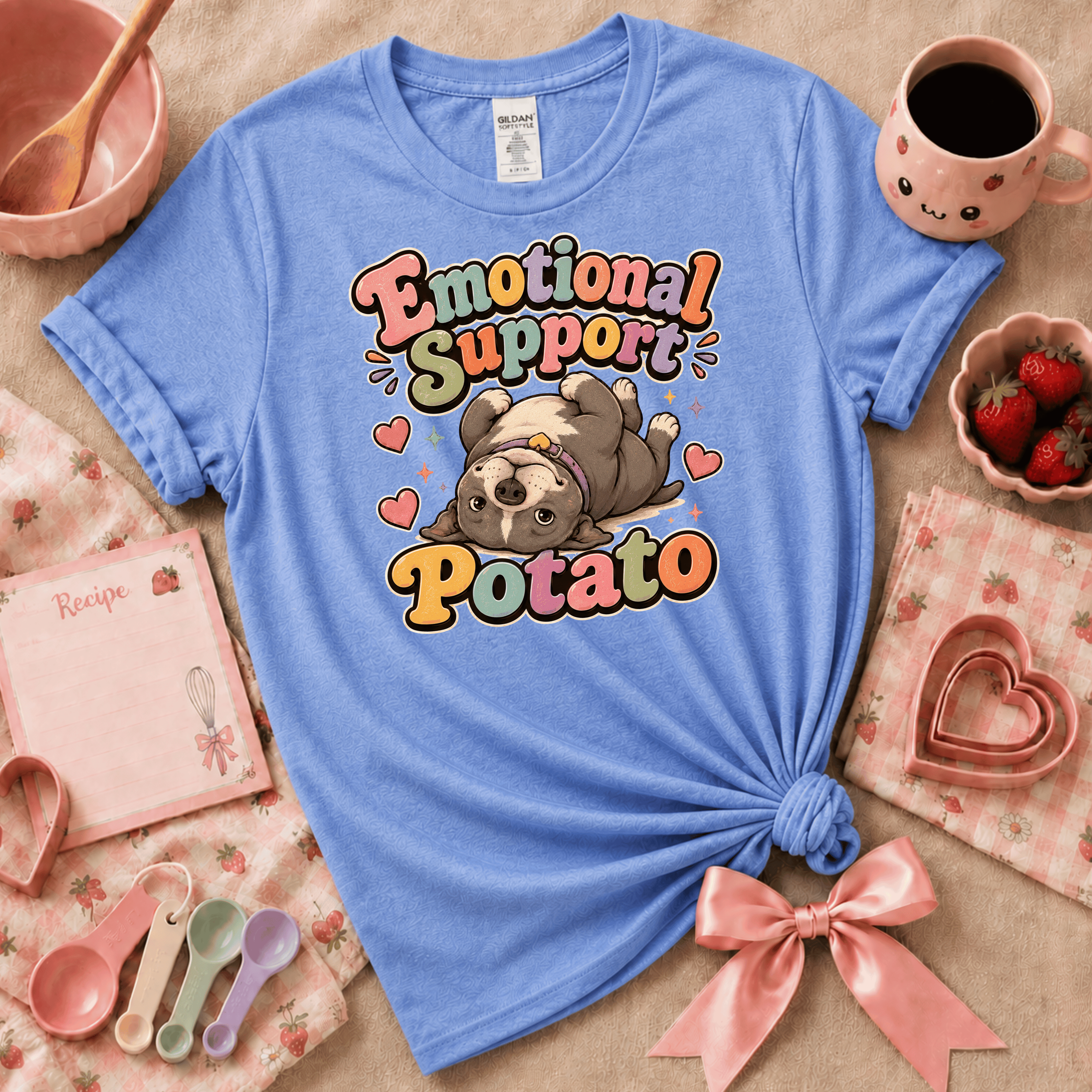 Emotional Support Potato cute animal graphic t-shirt displayed in a cozy flat lay in carolina blue.