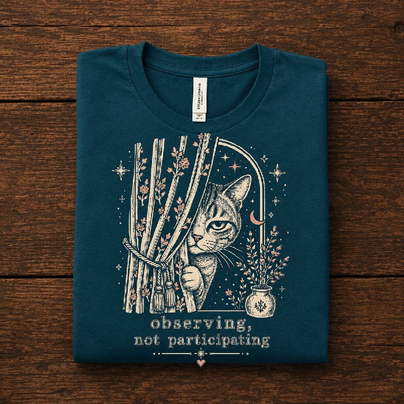Cat Observing Premium T-Shirt in deep teal, folded close-up