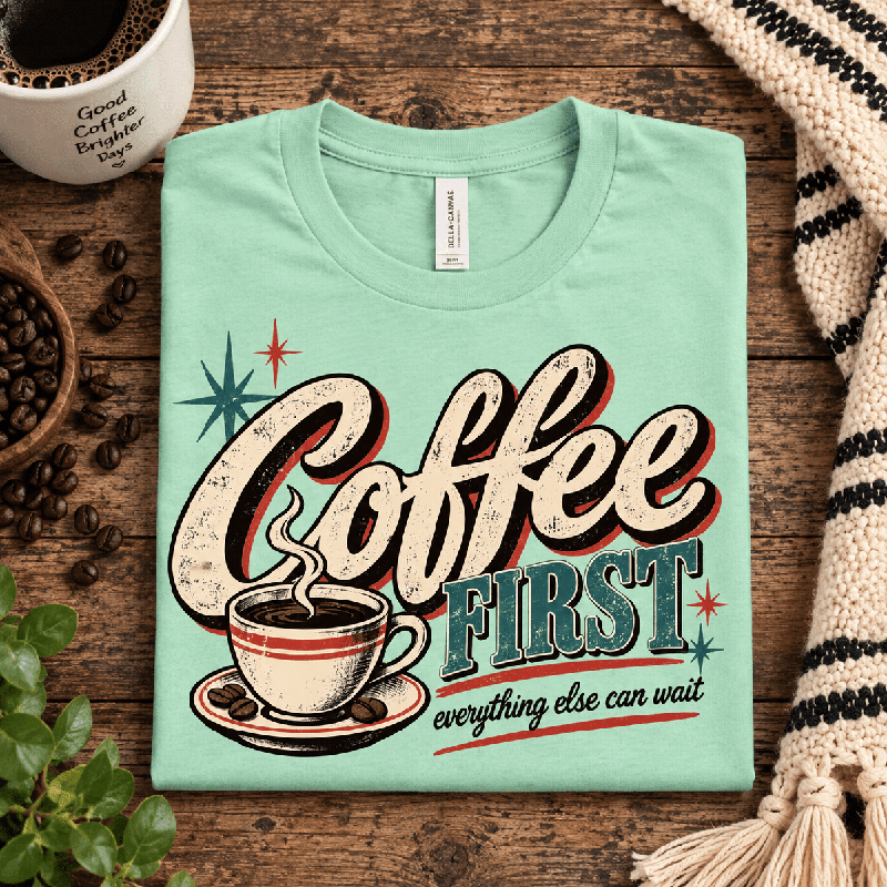 Coffee First Premium T-Shirt in mint, folded close-up with neck tag showing