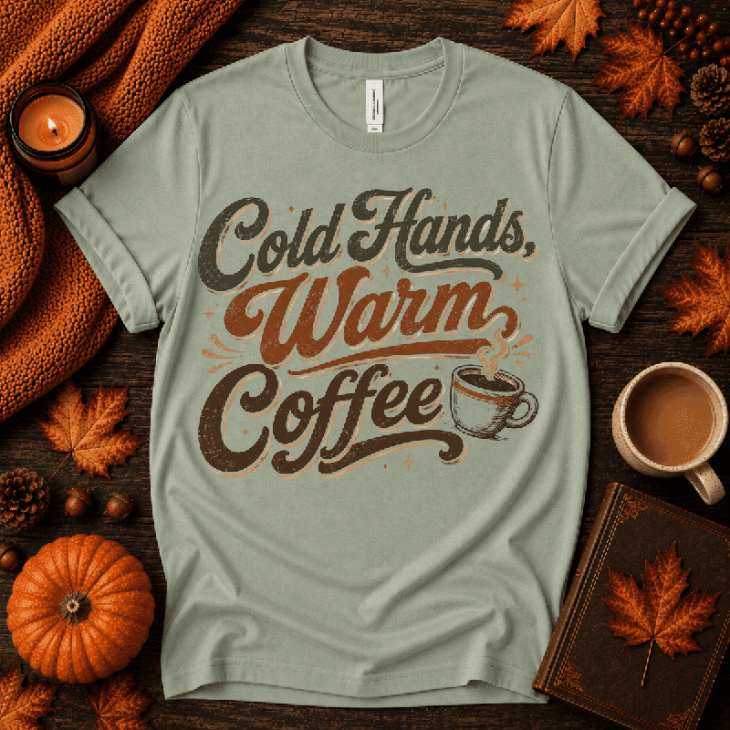 Cold Hands, Warm Coffee Premium T-Shirt in sage green, flat lay with autumn props