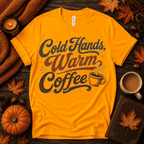 Cold Hands, Warm Coffee Premium T-Shirt in gold, flat lay with autumn props and steaming coffee cup script graphic