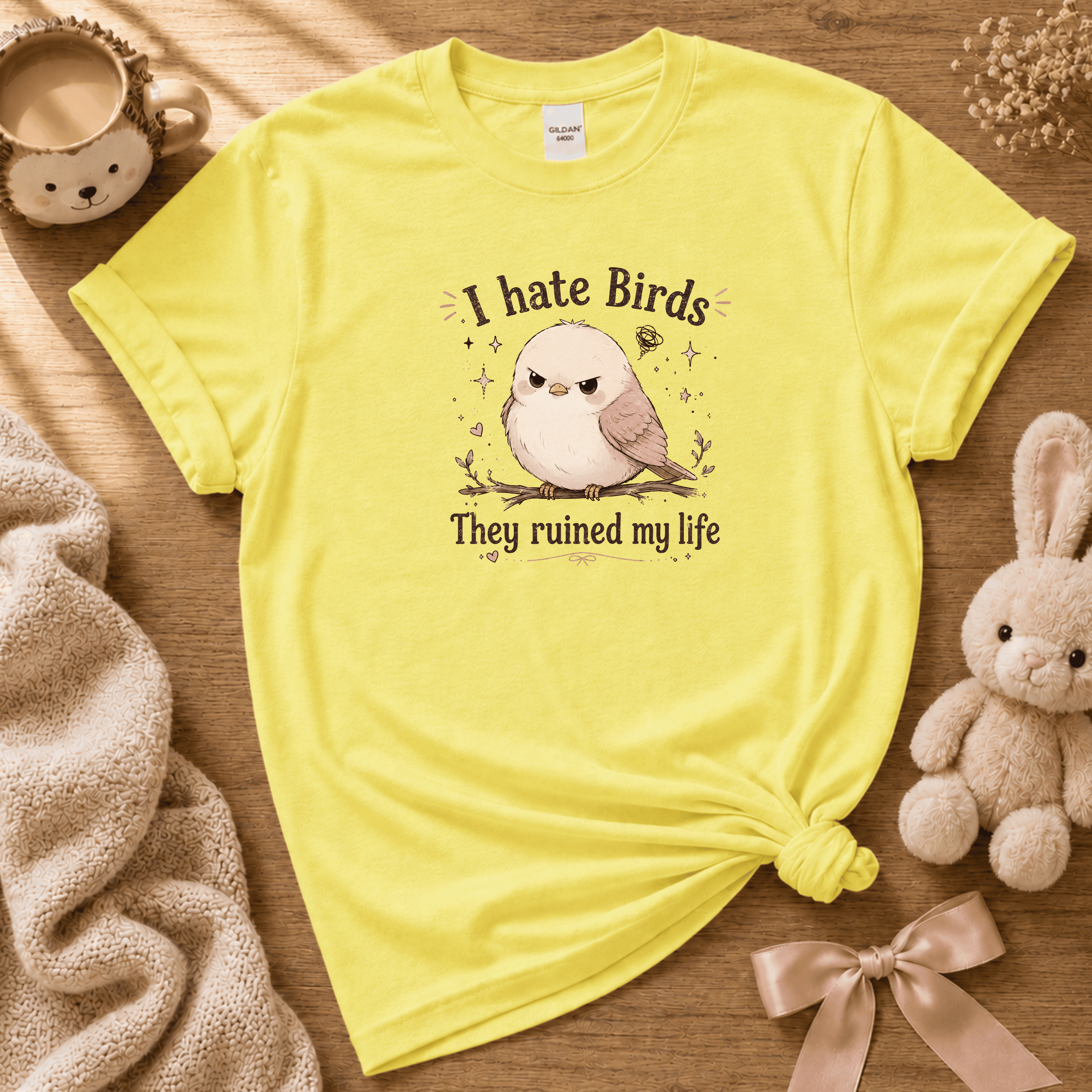 I Hate Birds cute animal graphic t-shirt displayed in a cozy flat lay in cornsilk yellow.
