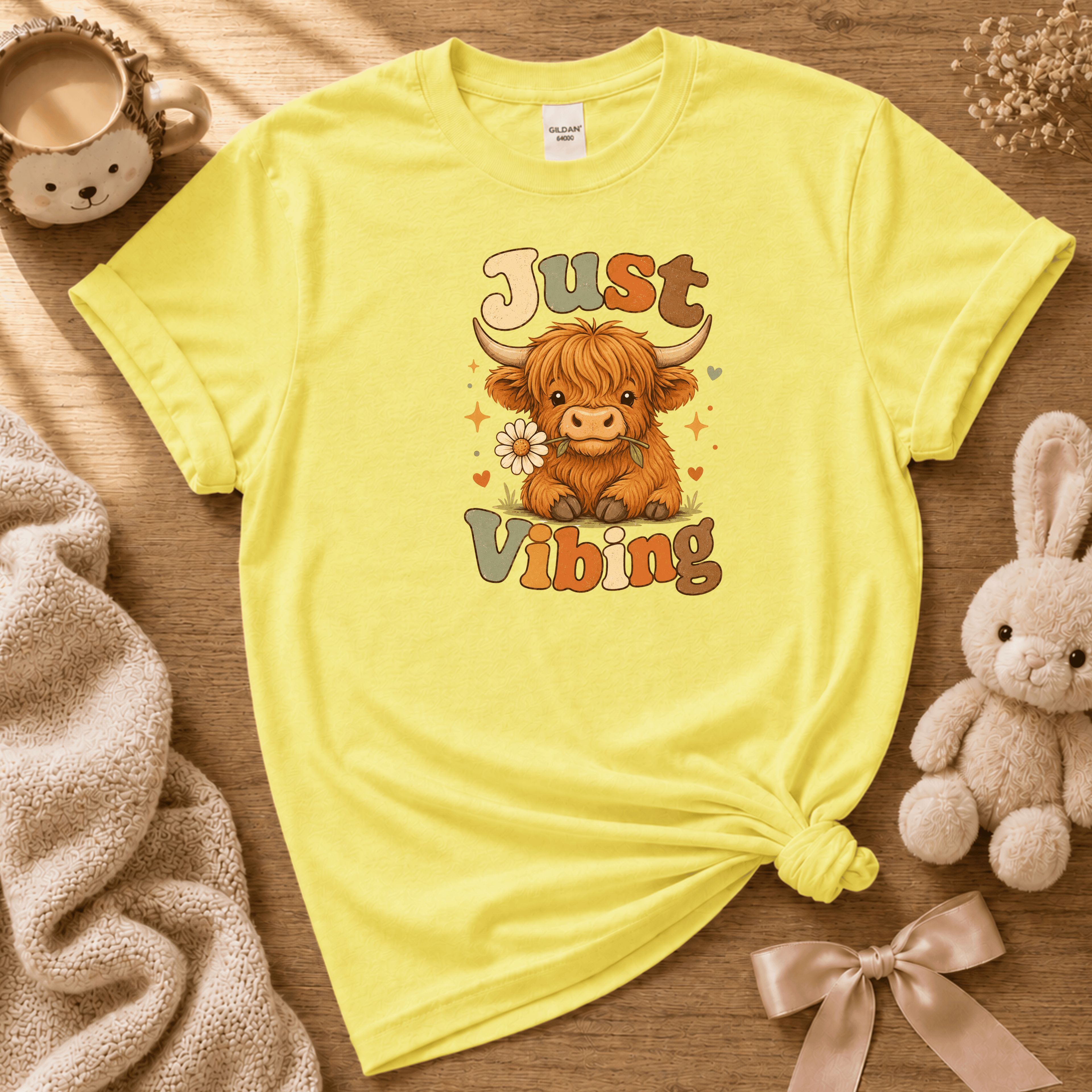 Cow Just Vibing cute animal graphic t-shirt cozy flat lay in cornsilk yellow.