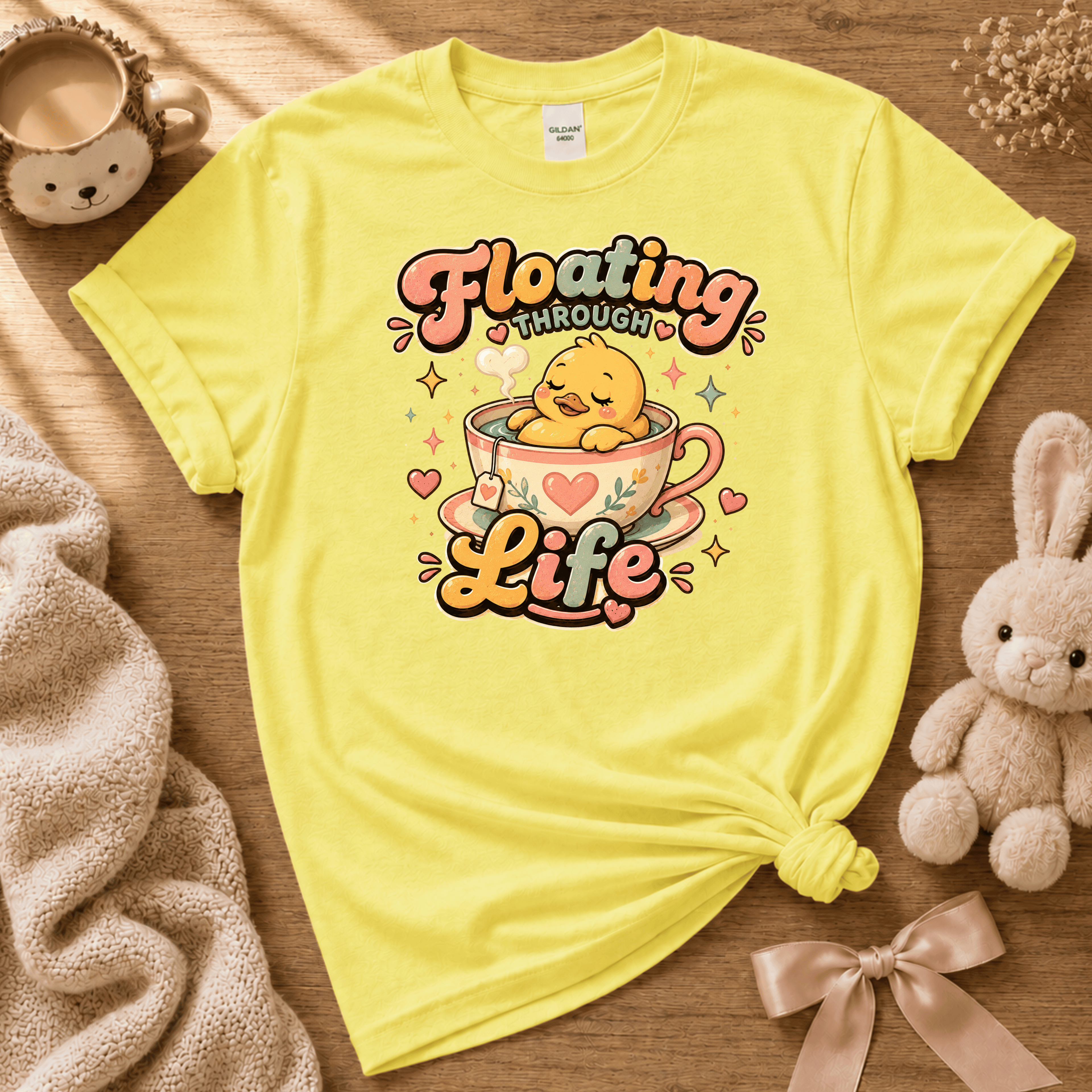 Floating Through Life cute animal graphic t-shirt cozy flat lay in cornsilk yellow.