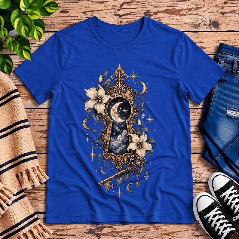 Cosmos Keyhole Premium T-Shirt in true royal blue, flat lay with ornate keyhole, starry moon, and floral graphic
