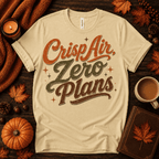 Crisp Air Premium T-Shirt in natural, flat lay with "Crisp Air, Zero Plans" script graphic and autumn props