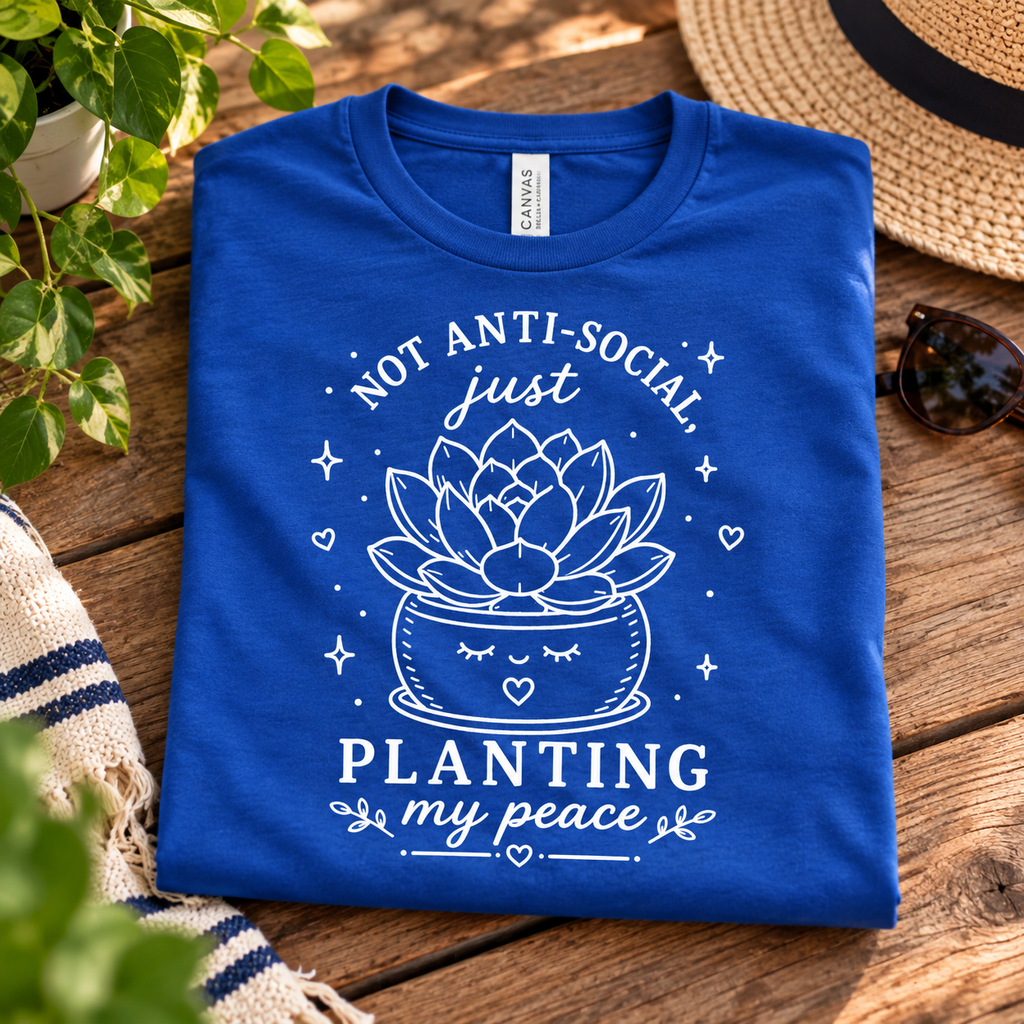 A folded mockup of Planting My Peace cute plant graphic t-shirt in true royal.
