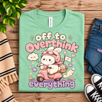 A folded mockup of Overthink Bunny cute animal graphic t-shirt in mint.