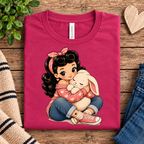 A folded mockup of Bunny Bonnie cute pinup graphic t-shirt in berry.