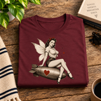 A folded mockup of Love Bomb vintage pinup graphic t-shirt in maroon.