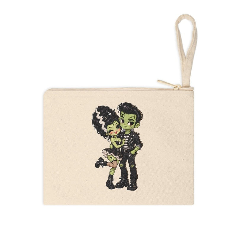 Frankie & Frannie Accessory Pouch in natural canvas, flat product photo showing the chibi Frankenstein couple graphic