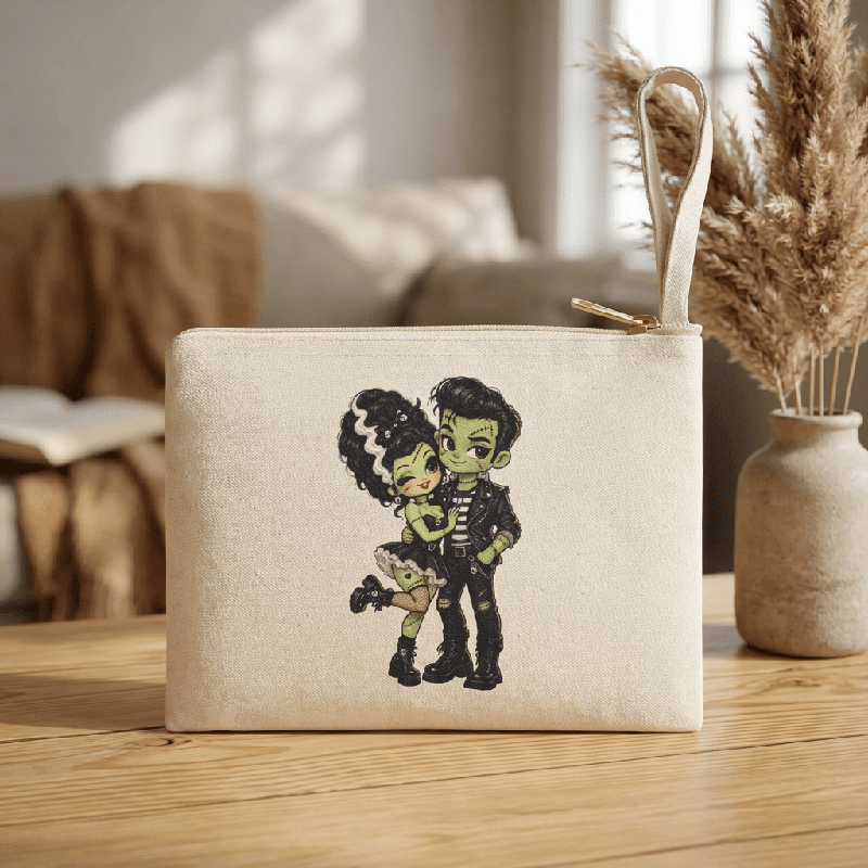 Frankie & Frannie Accessory Pouch in natural canvas, standing upright on a wood table with decor