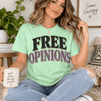 Woman holding a mug, wearing the Free Opinions Premium T-Shirt in mint