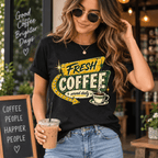 Woman holding an iced coffee near a cafe, wearing the Fresh Coffee Premium T-Shirt in vintage black