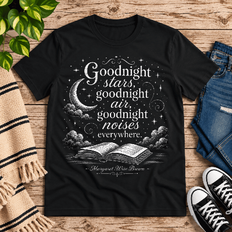 Goodnight Stars Premium T-Shirt in vintage black, flat lay with moon, stars, and open book quote graphic