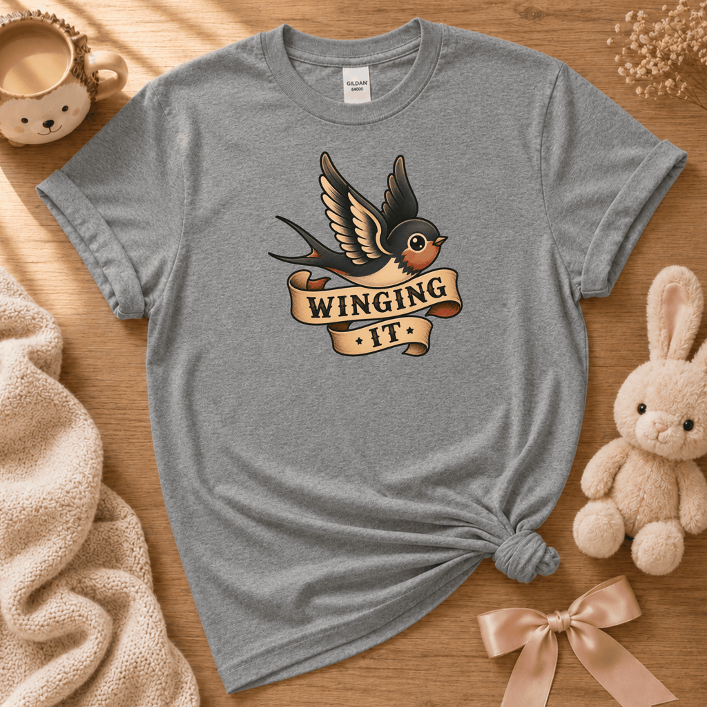 Winging It cute animal graphic t-shirt cozy flat lay in graphite heather.
