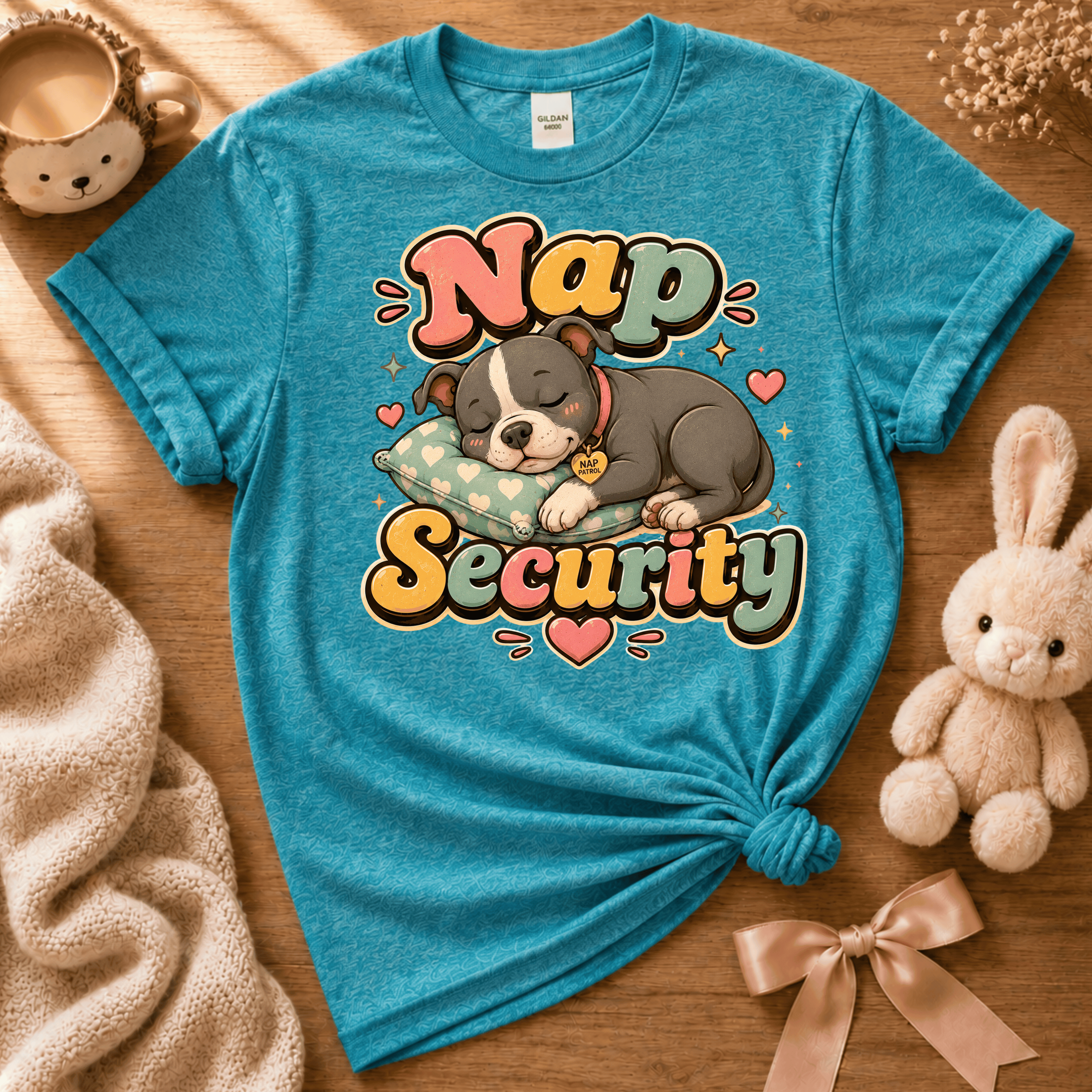 Nap Security cute animal graphic t-shirt displayed in a cozy flat lay in heather galapagos blue.