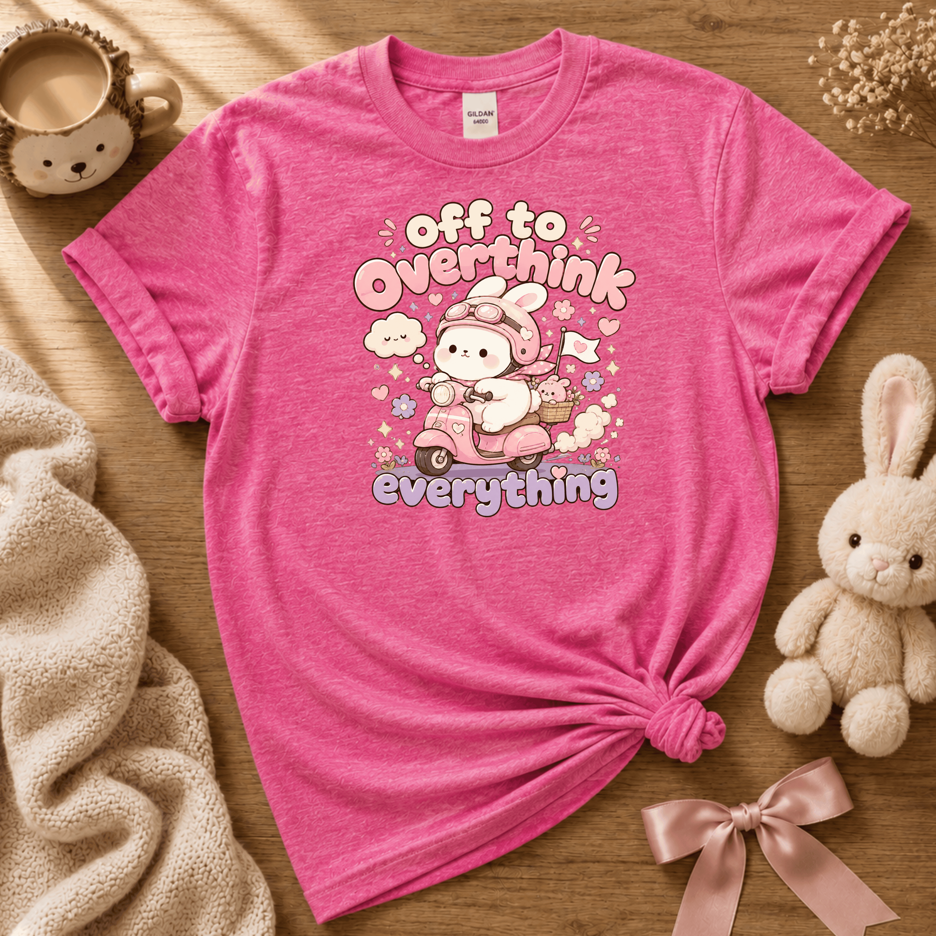 Overthink Bunny cute animal graphic t-shirt displayed in a cozy flat lay in heather heliconia.
