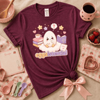 Eggsistential Kawaii cute food graphic t-shirt cozy flat lay in heather maroon.