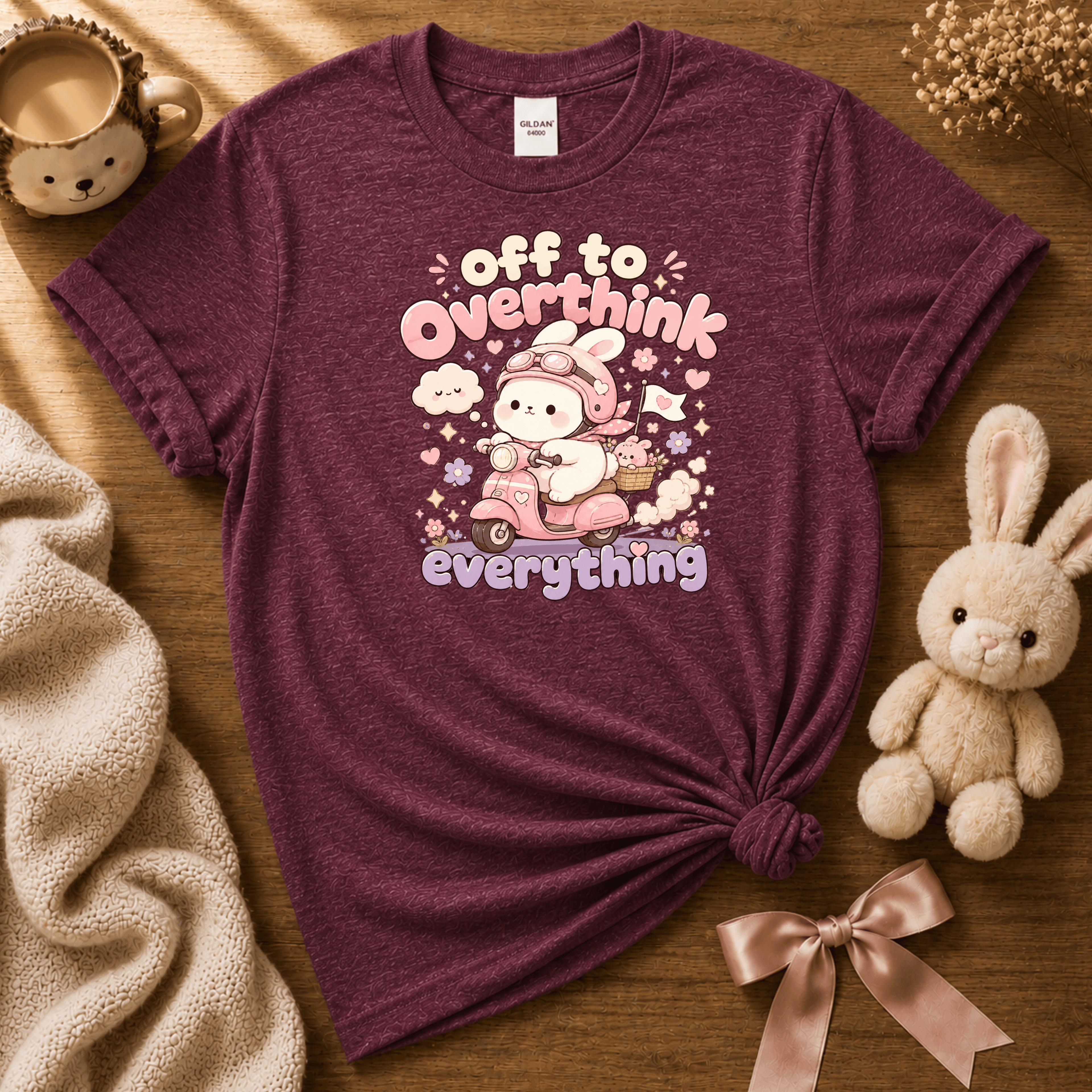 Overthink Bunny cute animal graphic t-shirt displayed in a cozy flat lay in heather maroon.