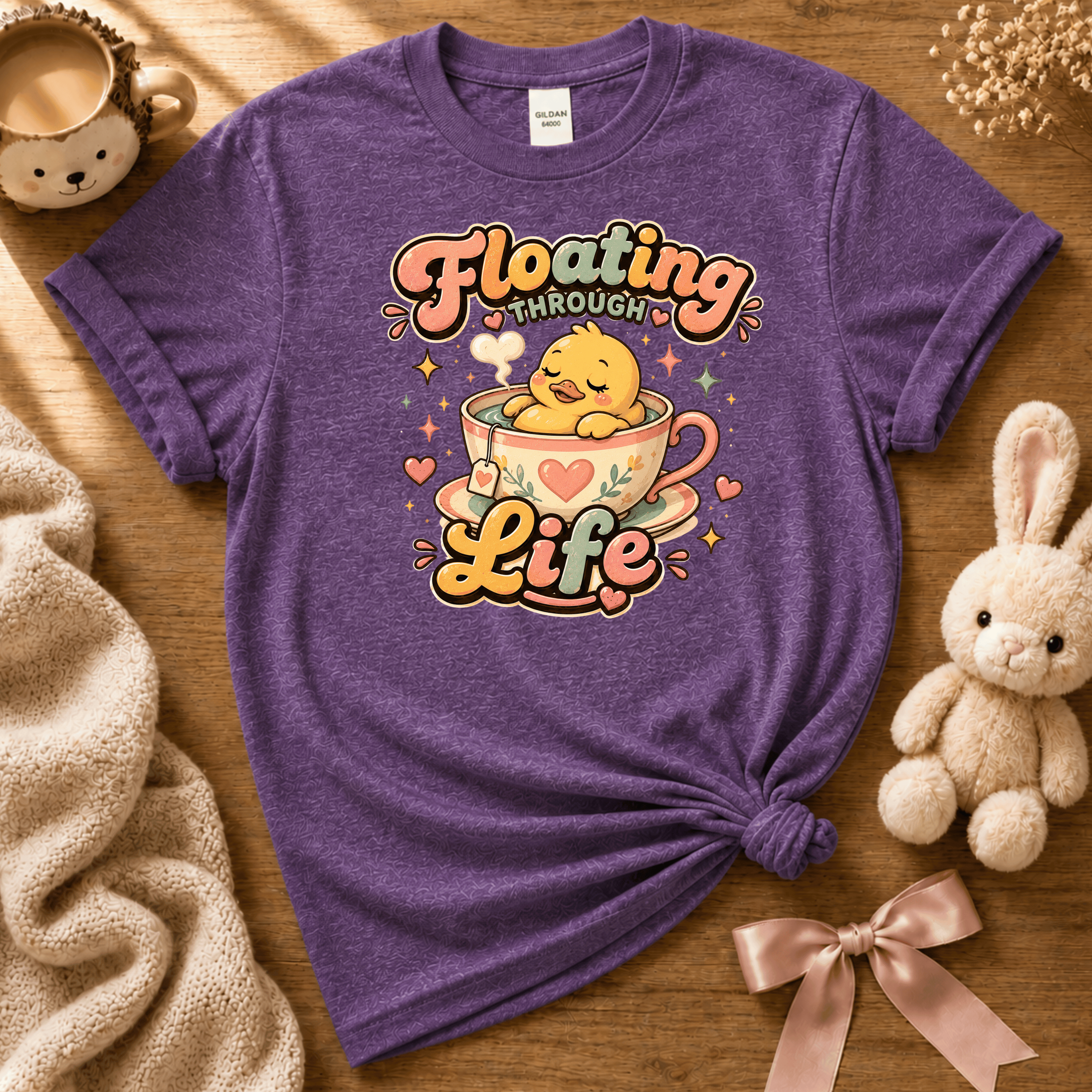 Floating Through Life cute animal graphic t-shirt cozy flat lay in heather purple.