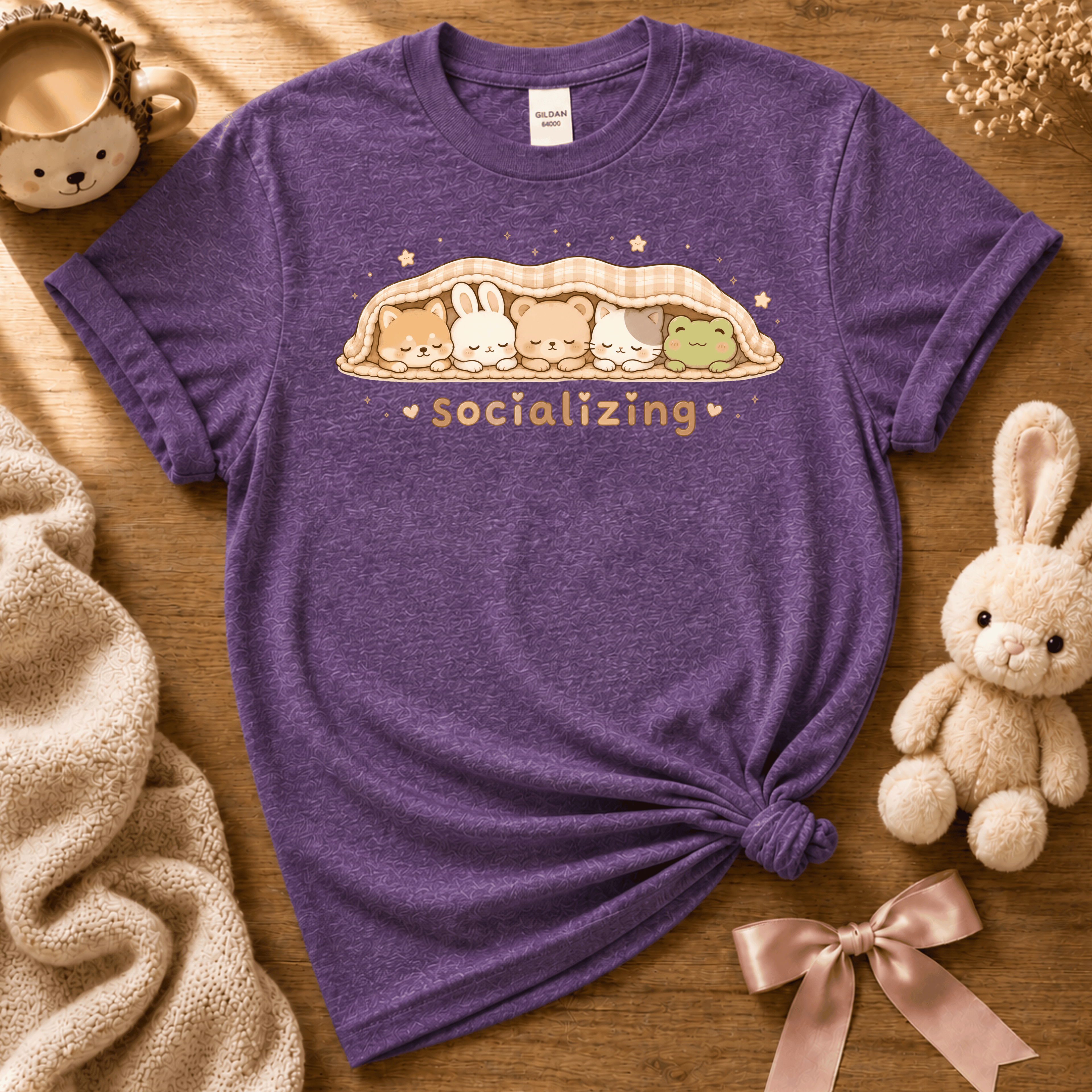 Socializing animal graphic t-shirt cozy flat lay in heather purple.