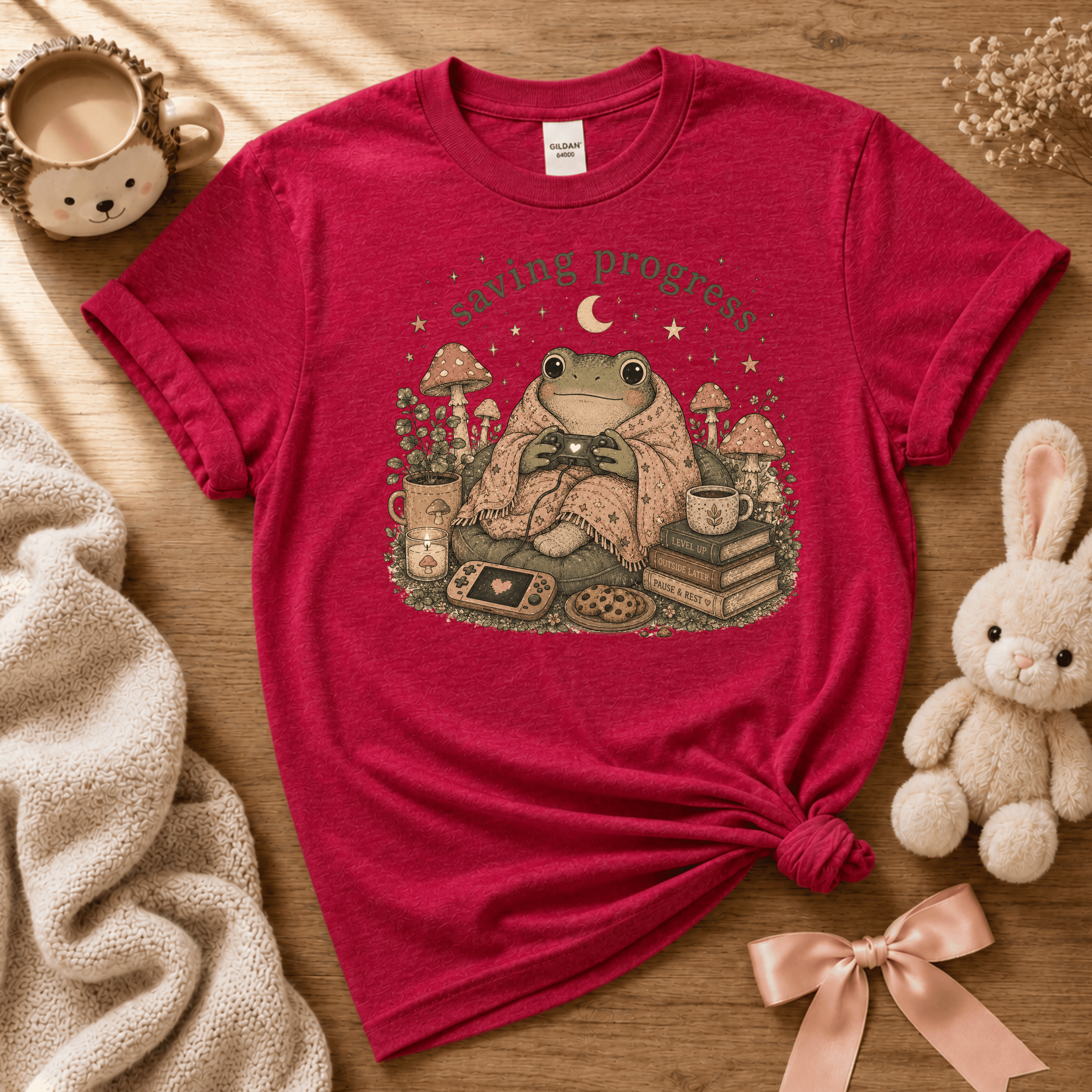 Saving Progress cute animal graphic t-shirt displayed in a cozy flat lay in heather red.