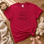 Peaceful, Quiet cute animal graphic t-shirt cozy flat lay in heather red.