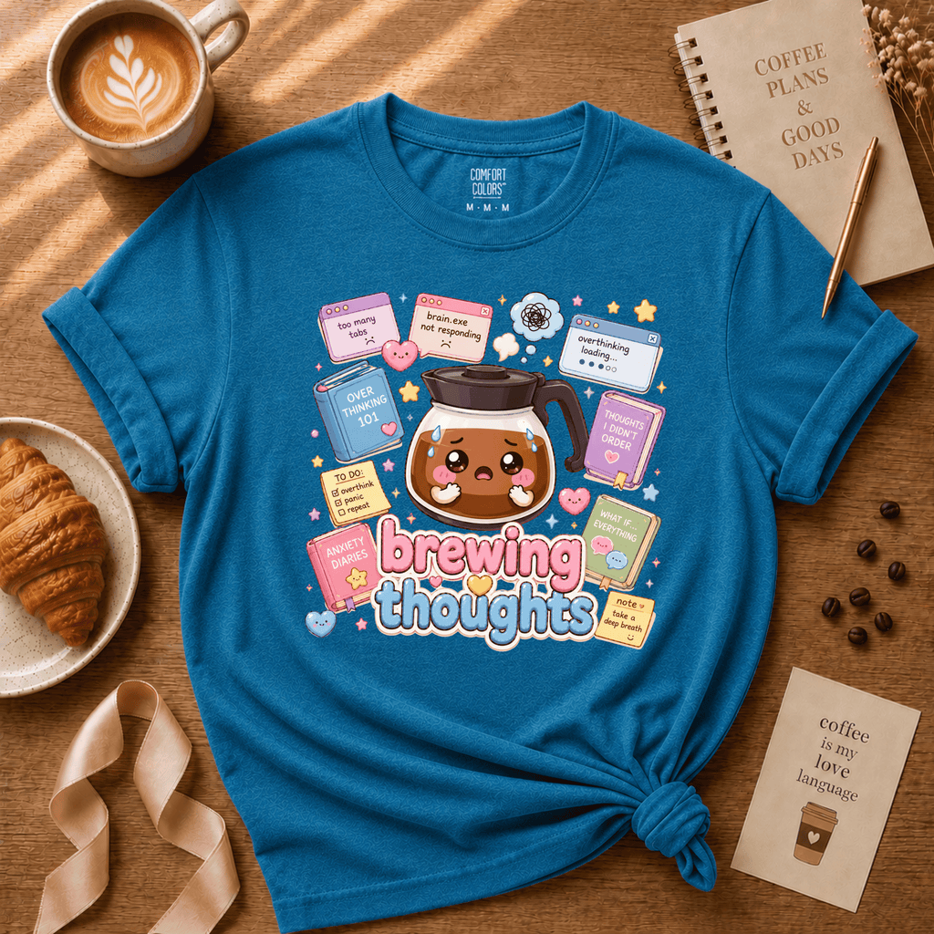 Brewing Thoughts coffee lover graphic t-shirt cozy flat lay in heather sapphire.