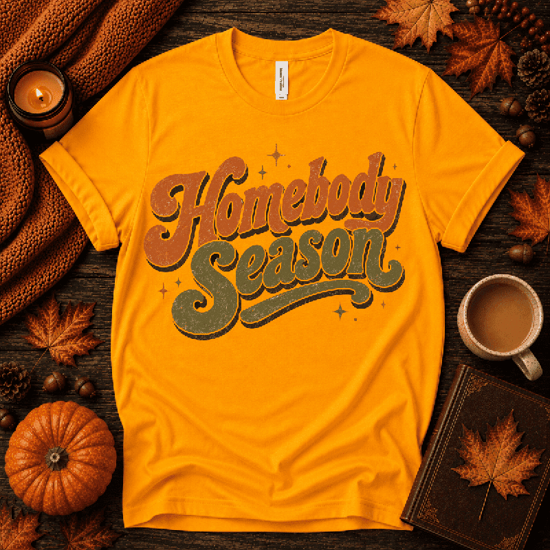 Homebody Season Premium T-Shirt in gold, flat lay with autumn props