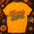 Homebody Season Premium T-Shirt in gold, flat lay with autumn props